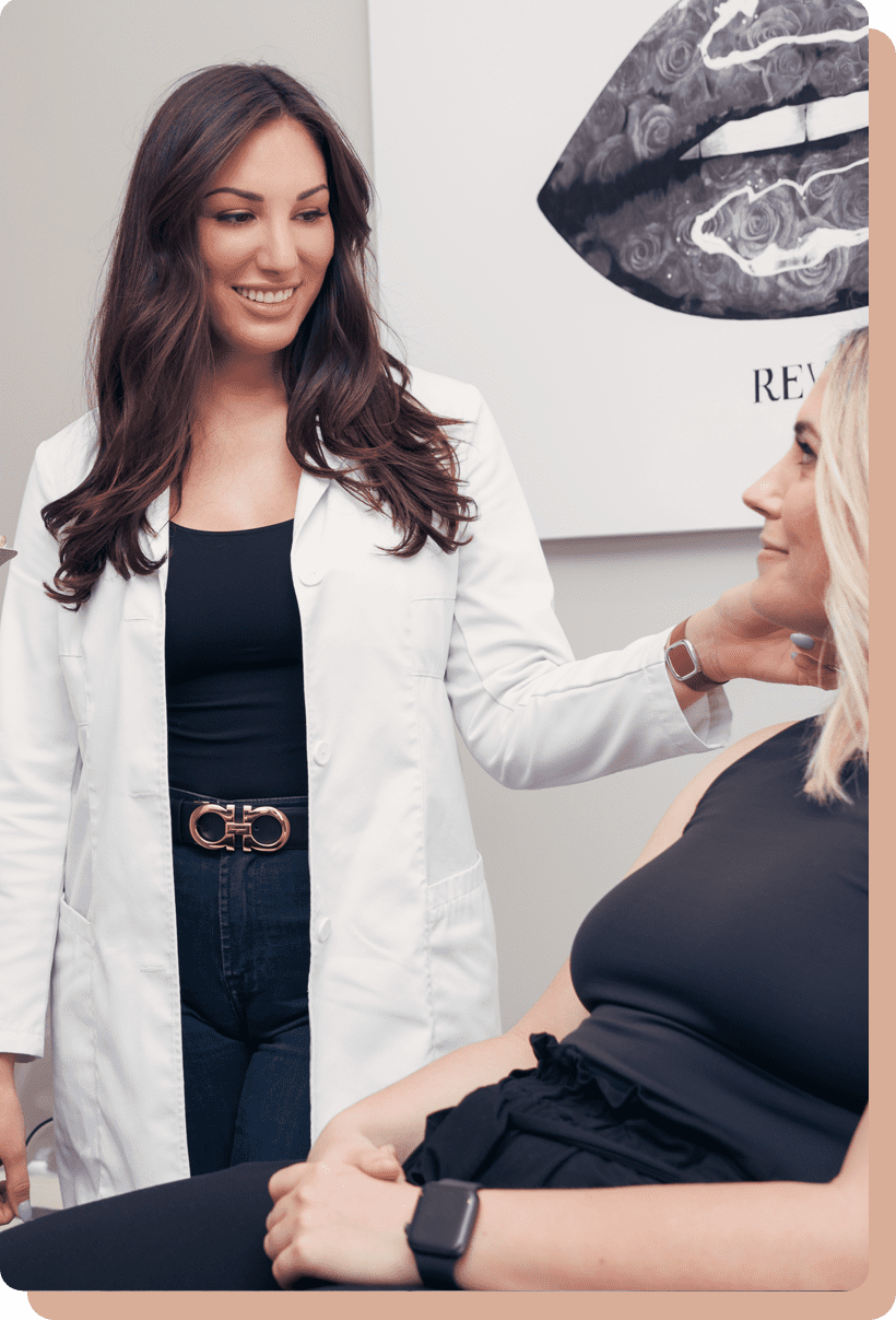 Medical nurse injector in consultation with patient.